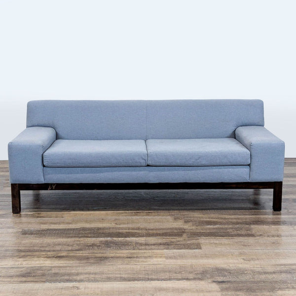 1. West Elm 3-seat sofa with wide track arms and wood legs, upholstered in a light blue fabric.