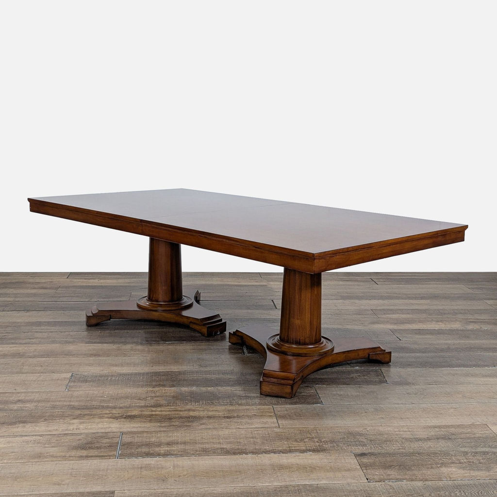 3. Angled view of Restoration Hardware double pedestal dining table, part of a set with matching upholstered chairs.