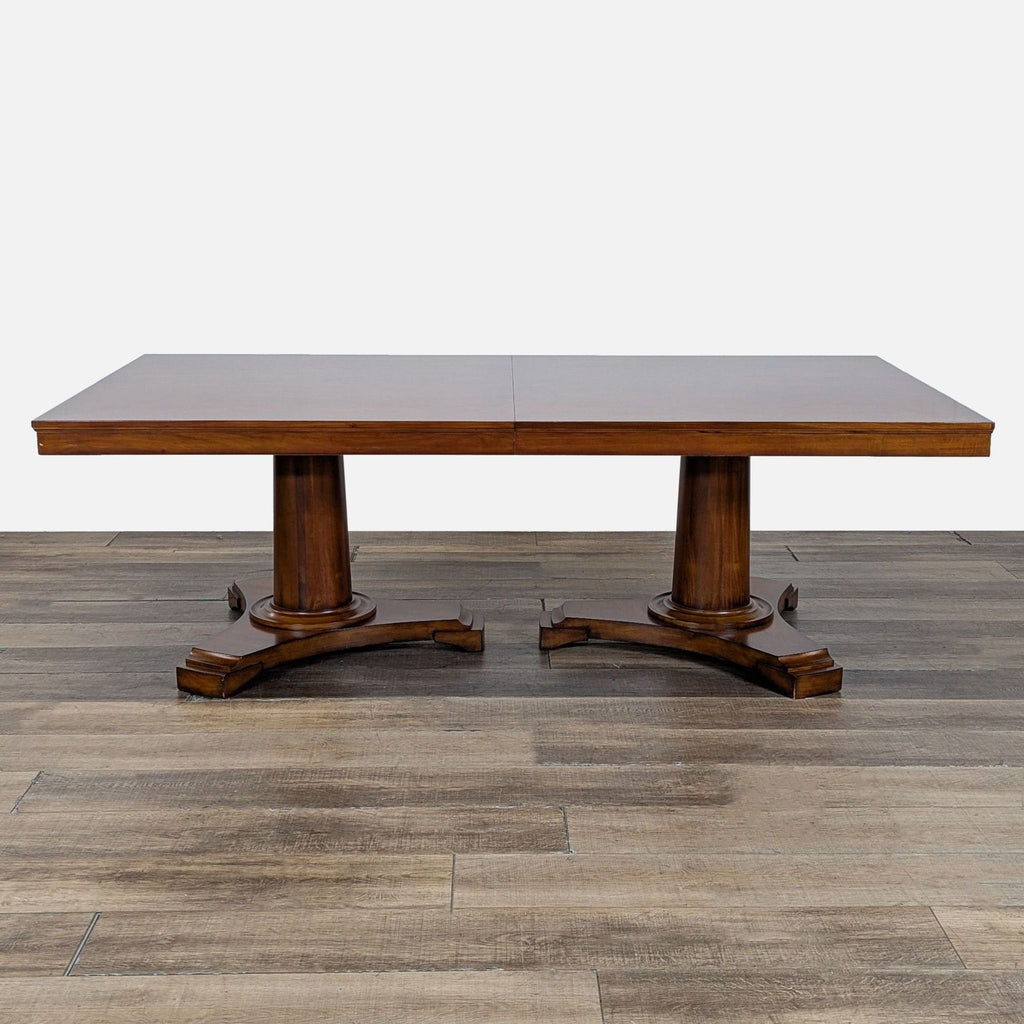 2. Rectangular extendable dining table with double pedestal base from Restoration Hardware, shown on wooden flooring.