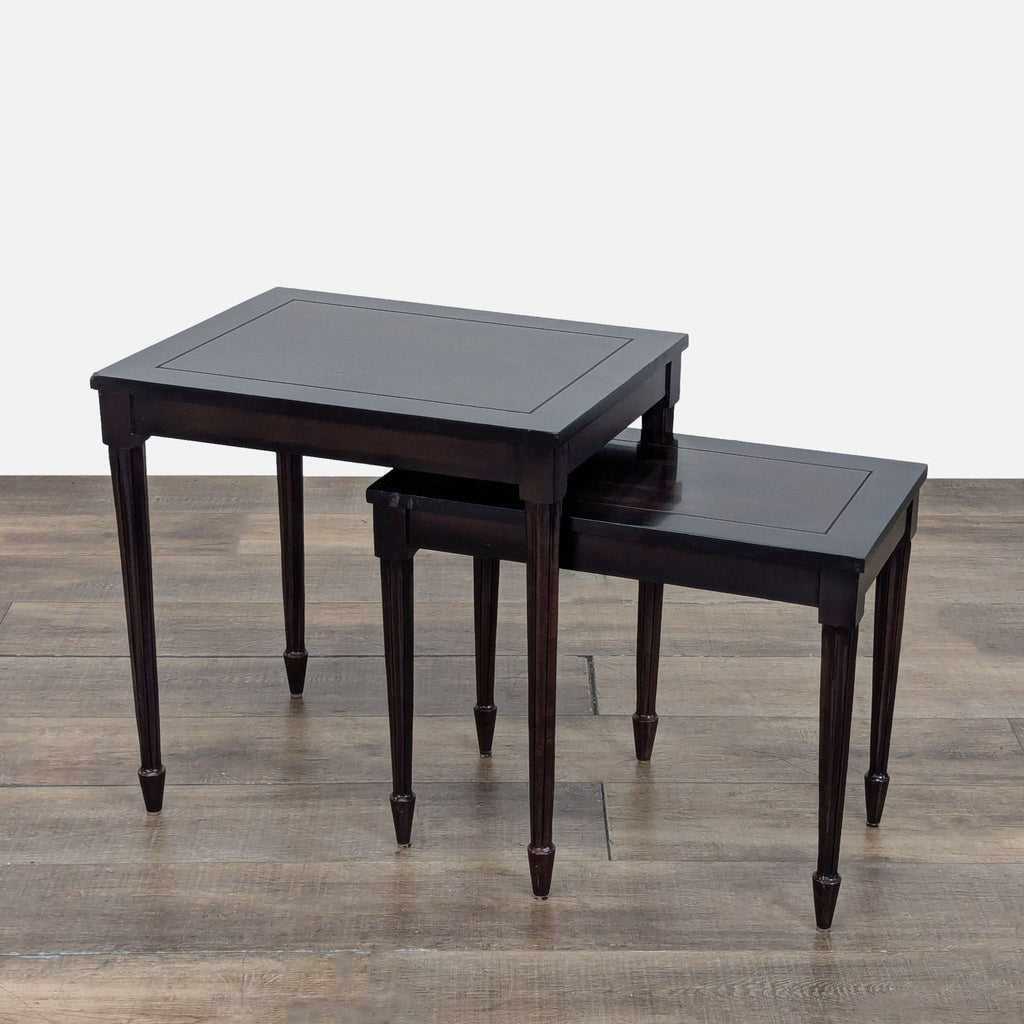 - Pair of Reperch end tables in dark wood, one nested under the other, shown on a wood floor.