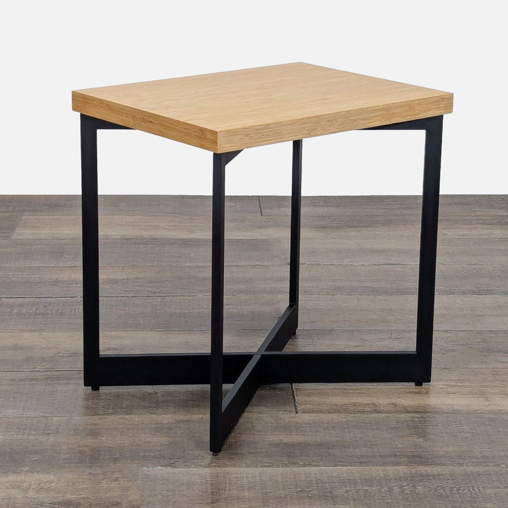 2. Modern Reperch end table featuring a rectangular wood surface and black cross-shaped metal legs.