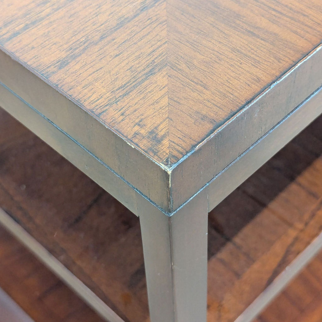 3. Detailed angle of the Crate & Barrel end table’s top surface, highlighting the wood pattern and edges.