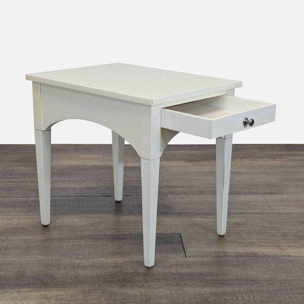 2. Angled view of a white Reperch console table with the drawer open, highlighting its storage feature.  