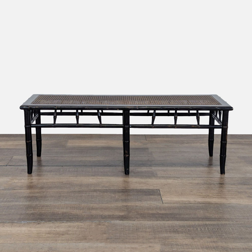 1. Rectangular Reperch bench with black bamboo-style frame and woven rattan seat, shown against a wooden floor.