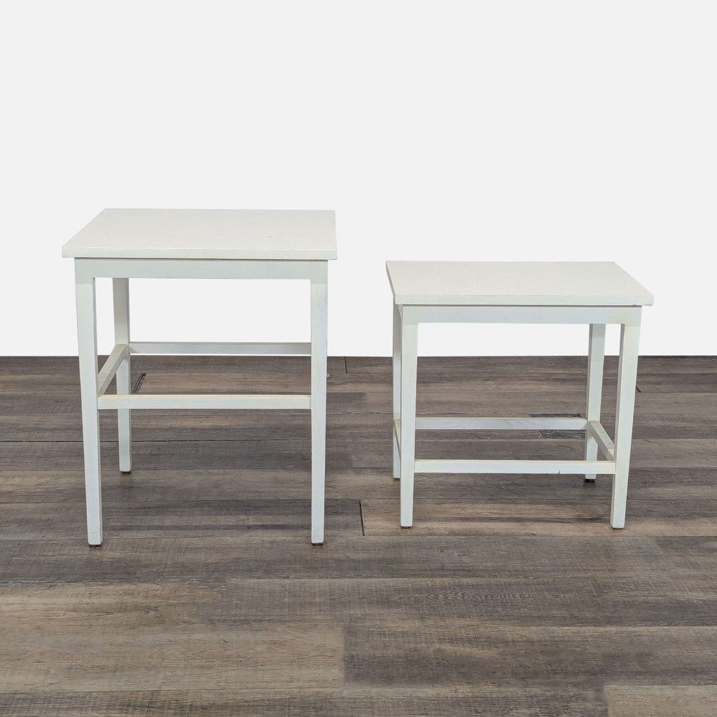 3. Two white Reperch end tables displayed apart, highlighting their simple, square design.