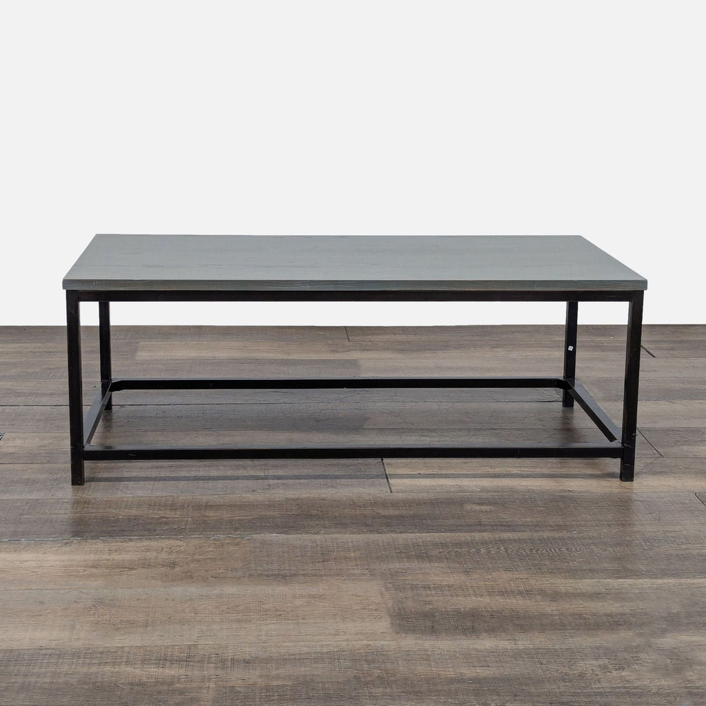 1. Rectangular Reperch coffee table with a metal frame and a wood top, shown on a wooden floor.