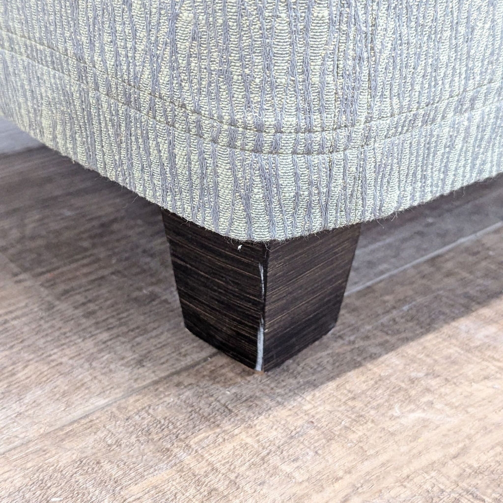Slip Covered Ottoman on Wood Feet