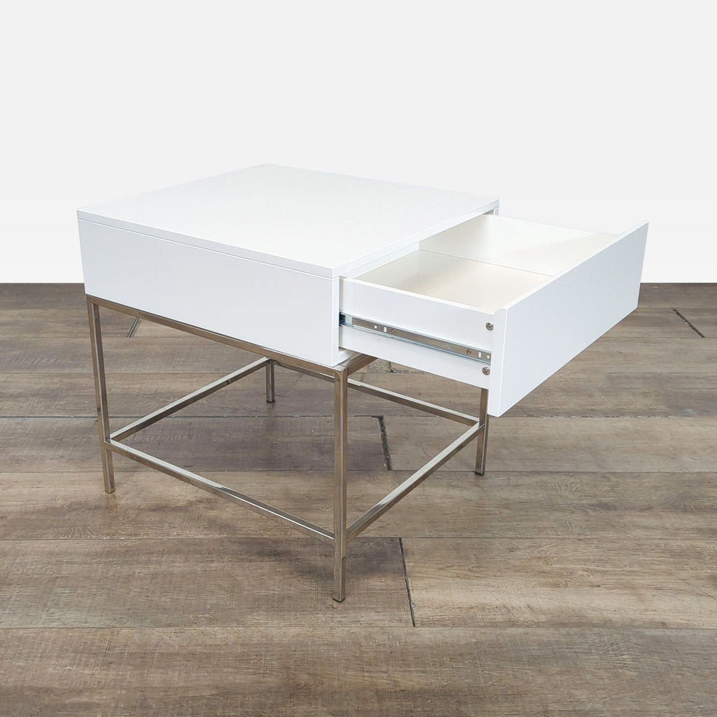 Modern square side or console table by West Elm, featuring a metal frame and open drawer.