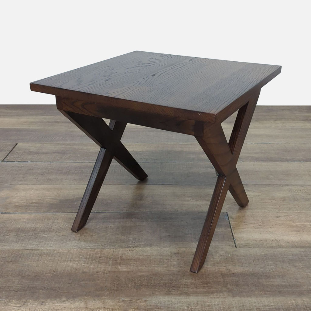 1. Reperch end table with dark wood finish and X-shaped legs, photographed on a wood floor.