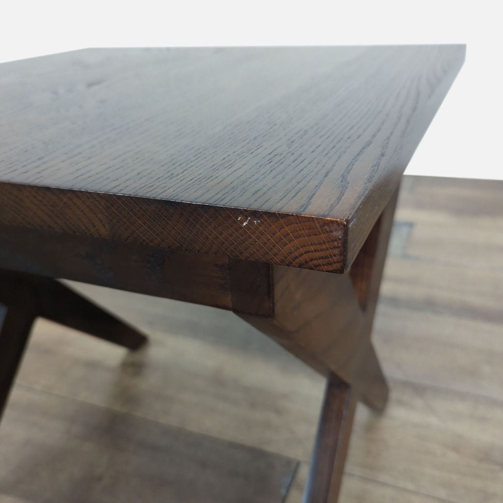 3. Close-up of Reperch end table's smooth dark wood top and detailed corner craftsmanship.