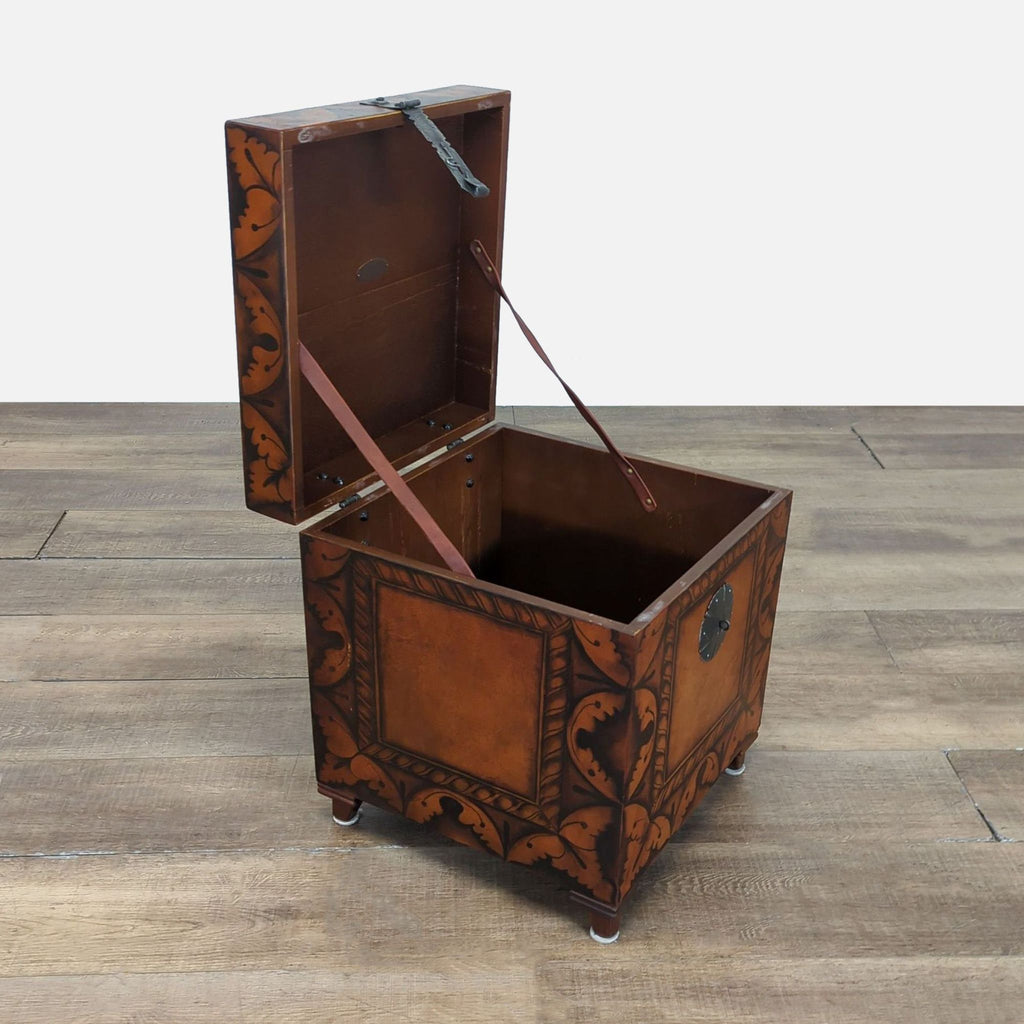 2. The South Cone trunk open, revealing the spacious interior and decorative exterior with leaf motifs.