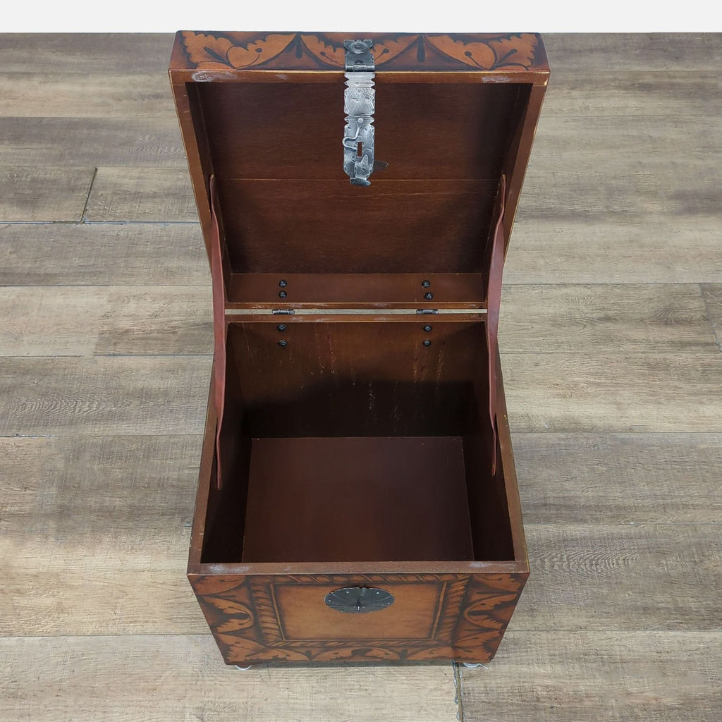 3. Top view of the South Cone trunk with the lid open, showing the empty wooden storage space inside.