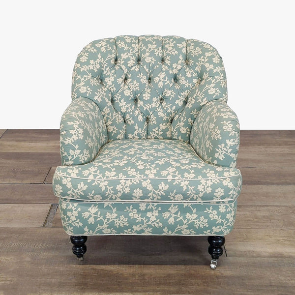 1. Lounge chair with floral upholstery, button tufting, and turned wood legs with casters by Cisco Brothers.