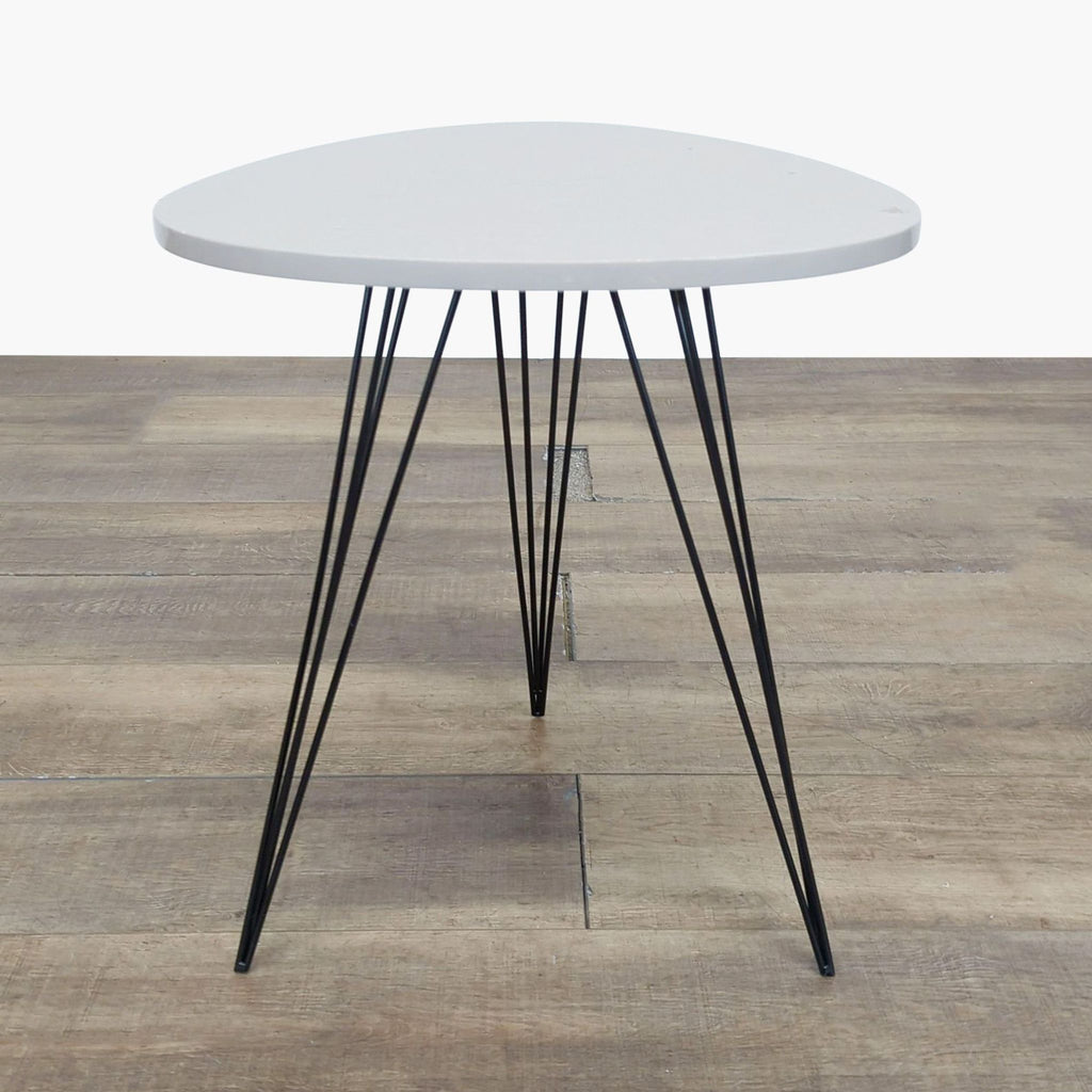 1. Safavieh side table with a lacquered top and black iron hairpin legs shown against a wood floor.
