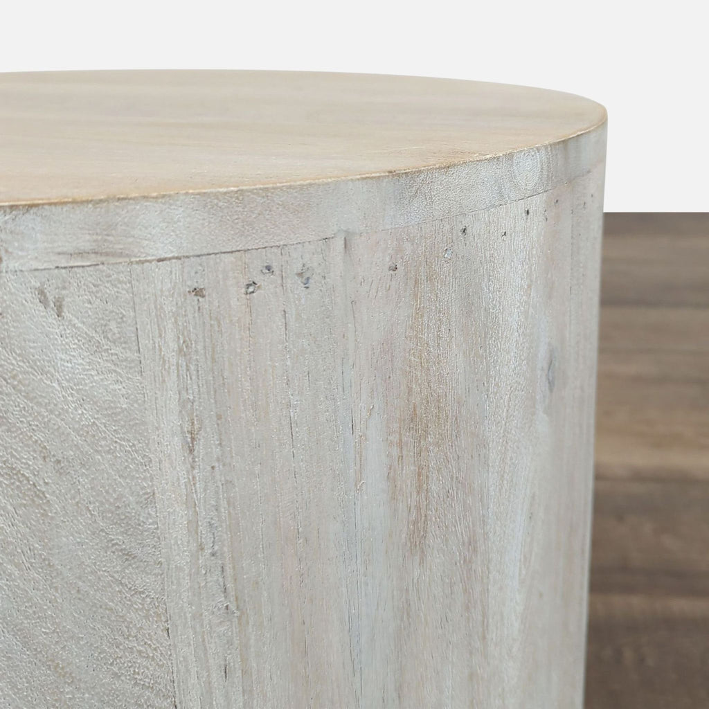 2. Close-up of the Reperch side table’s texture, highlighting the smooth, pale wood grain.  