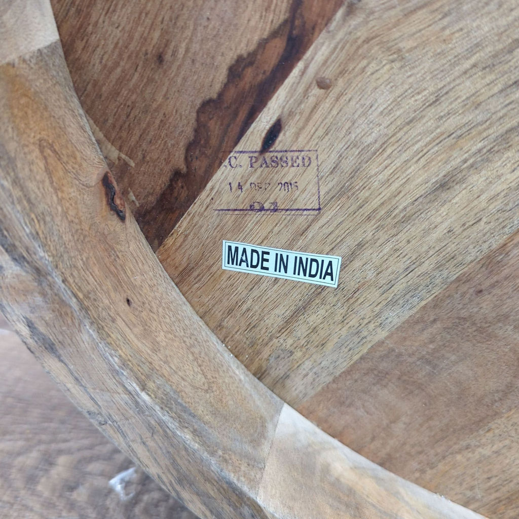 3. Underside of the Reperch table showing a "MADE IN INDIA" label and wood stamp.