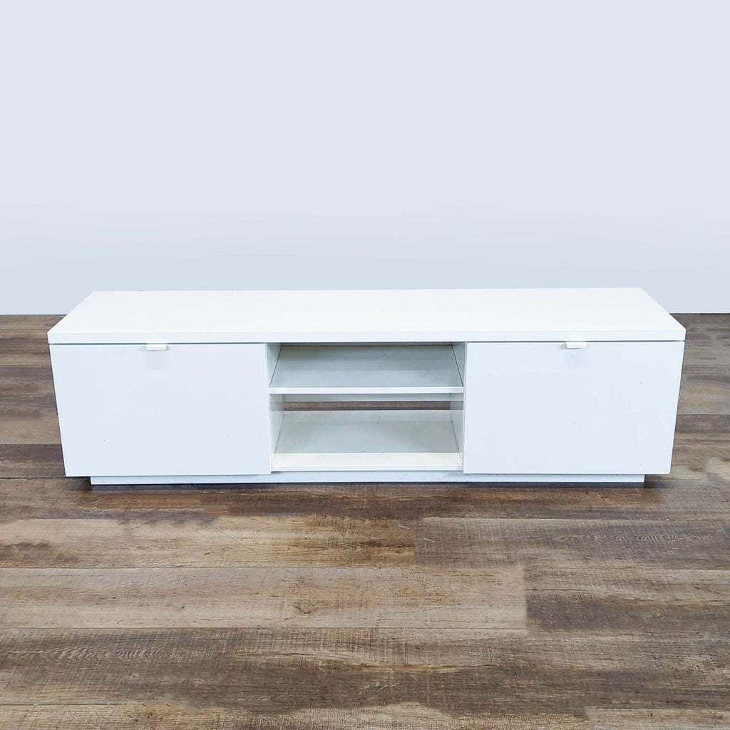1. White Reperch entertainment center with two doors and open middle shelves, viewed from the front on wood floor.