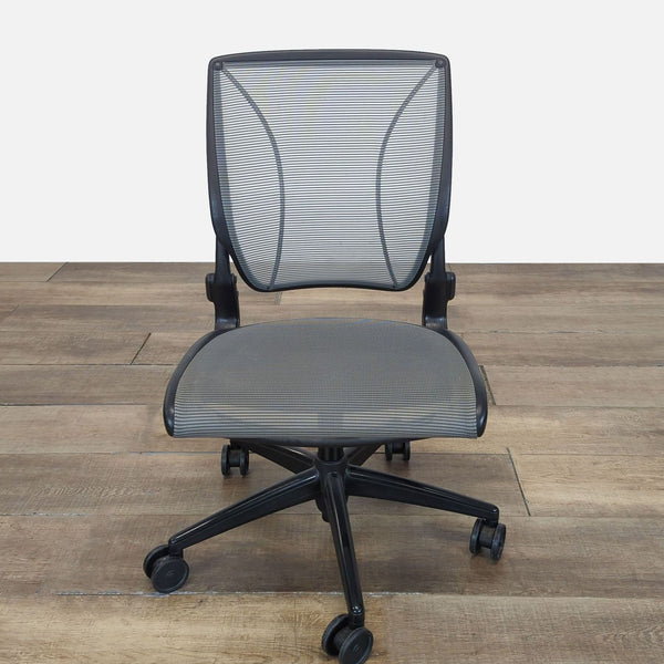 Front view of a Humanscale chair featuring a tri-panel mesh backrest and a mesh seat on caster wheels.  
