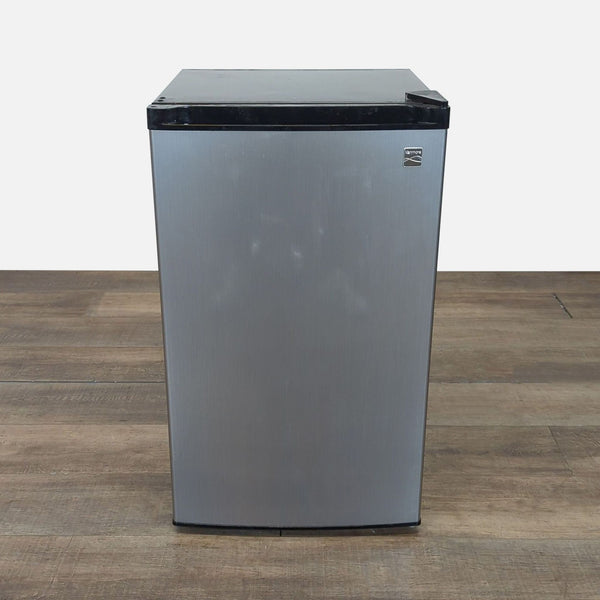 1. Front view of a Kenmore compact mini refrigerator, ideal for small spaces, shown with a closed door.
