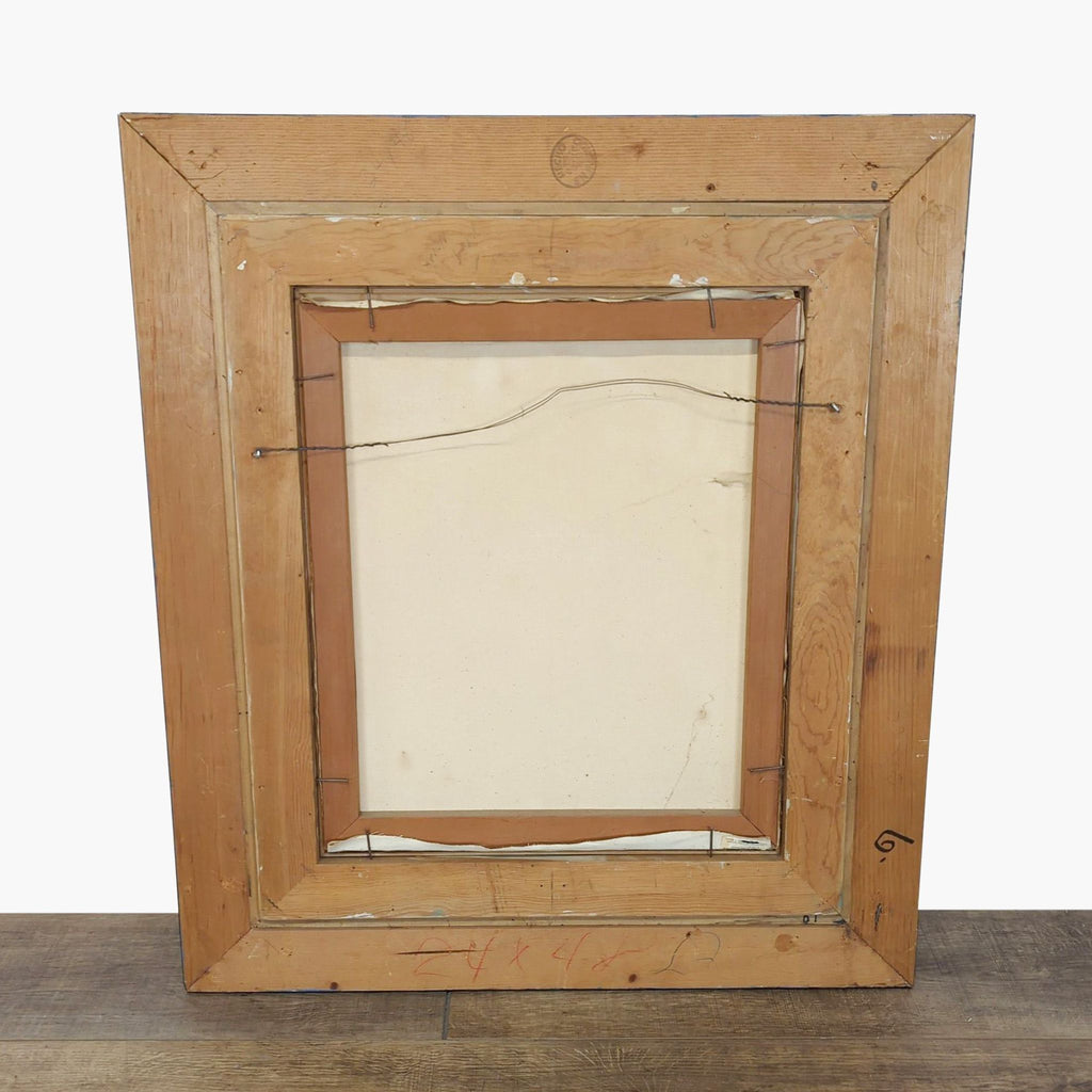 3. Rear view of the framed canvas print, showing wooden frame construction and hanging wire attached.