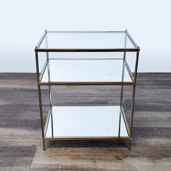 1. Reperch side table with a glass top, mirrored shelves, and a gold-finished metal frame.