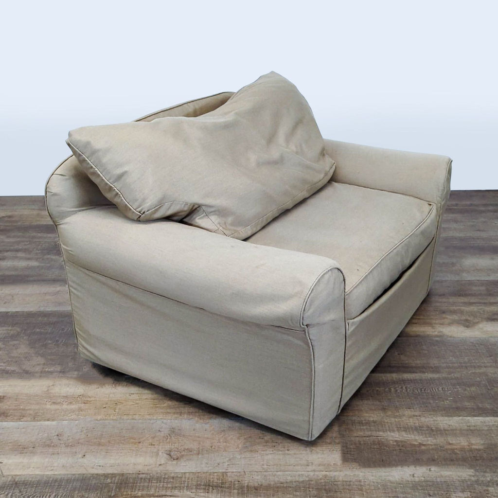 3. Angled side view of the Reperch Bridge lounge chair with soft slipcover, suitable for lounging.