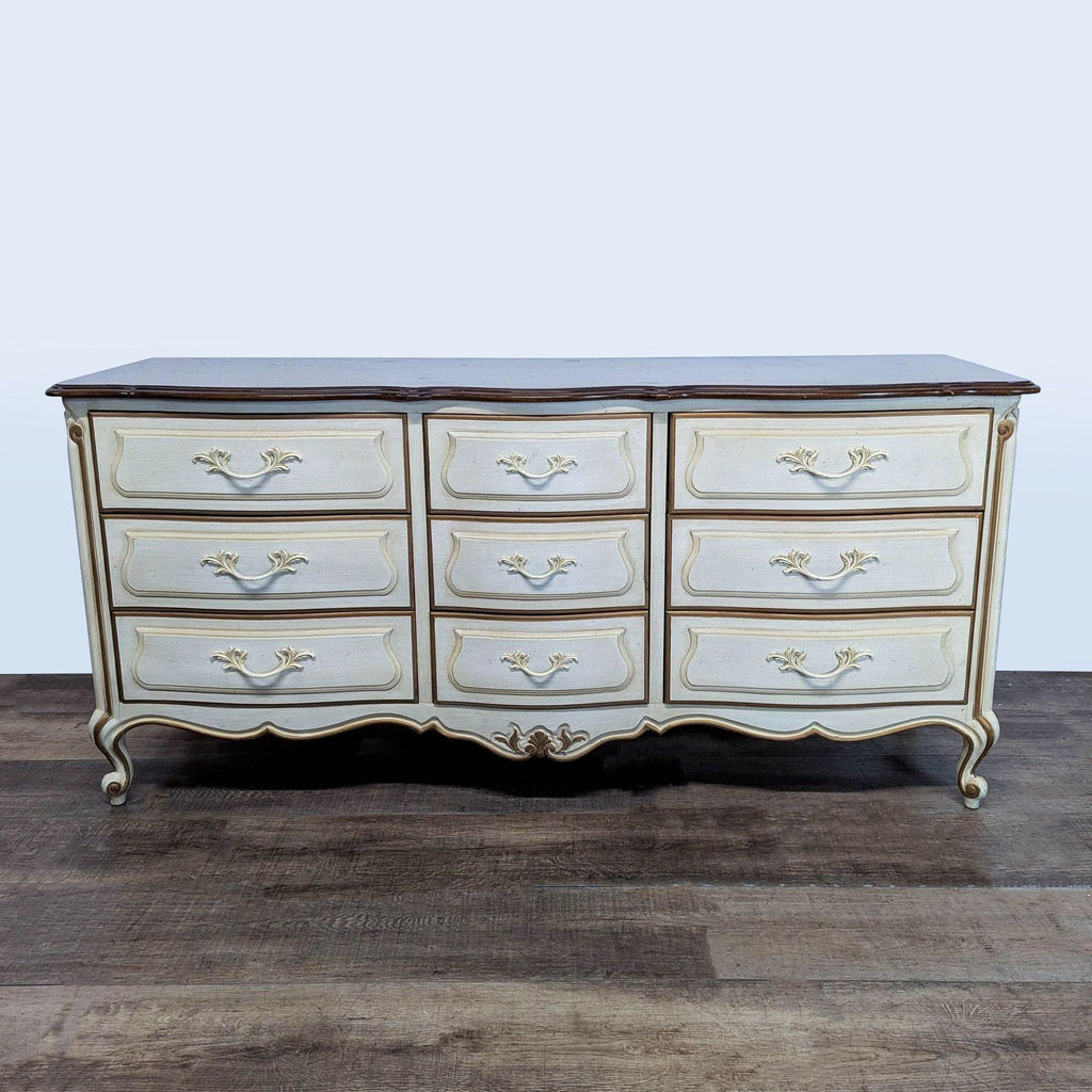 Vintage Drexel Heritage dresser with ornate details, delicate curves, and original hardware, shown front view.  