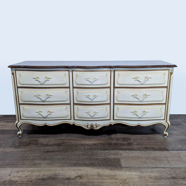 Vintage Drexel Heritage dresser with ornate details, delicate curves, and original hardware, shown front view.  
