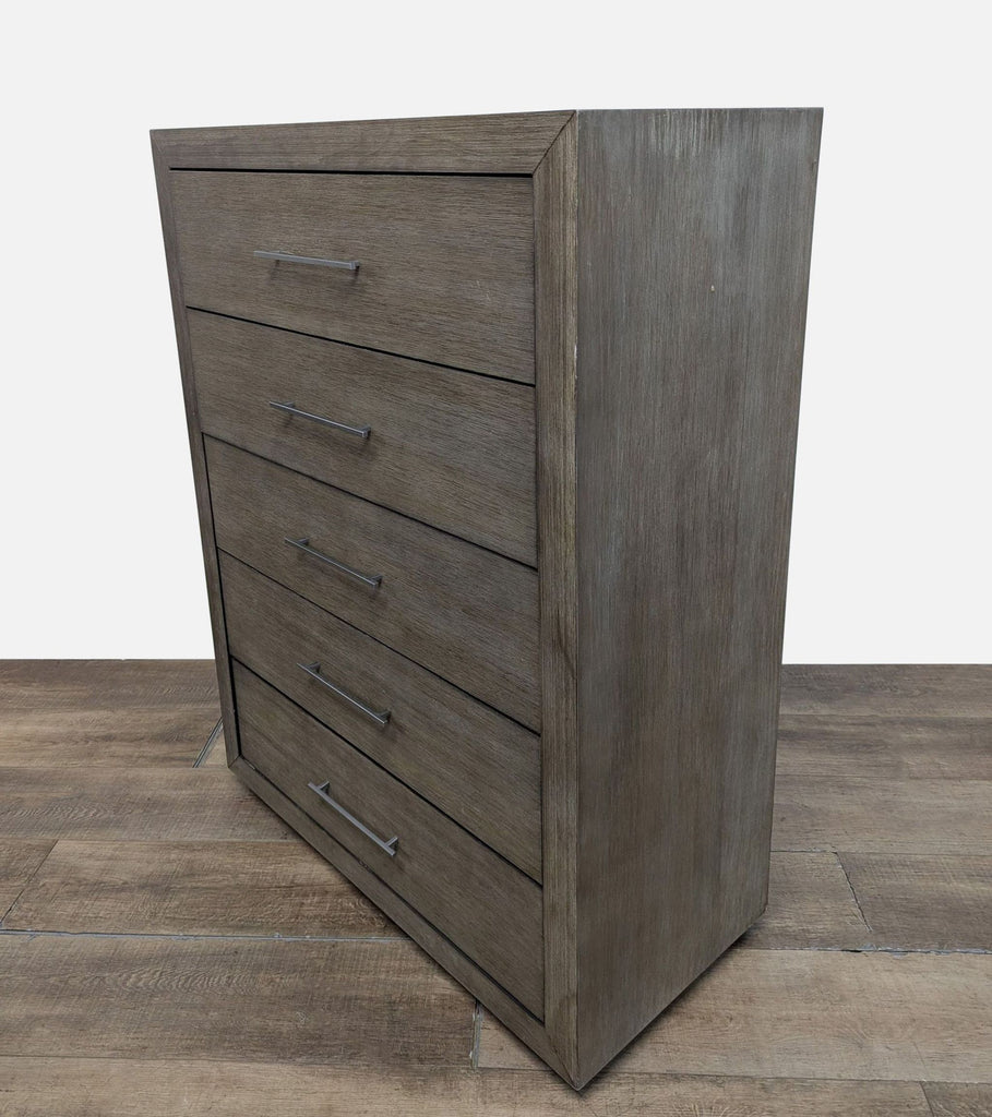 3. Five-drawer Modus dresser in rustic pine with visible wood grain and sleek metal handles.