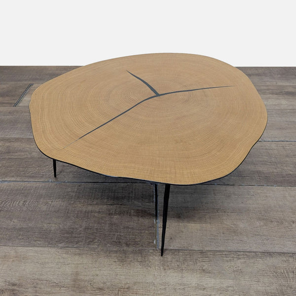 1. Organic-shaped wood coffee table by Industry West with natural rings and black accents on slim metal legs.