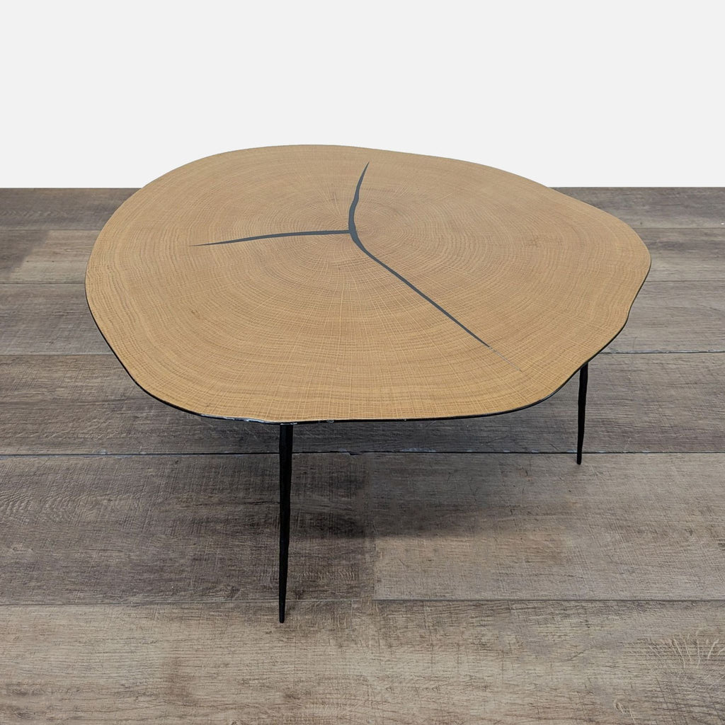 2. Industry West coffee table featuring a live-edge wood top and minimalist black metal legs, viewed from the front.
