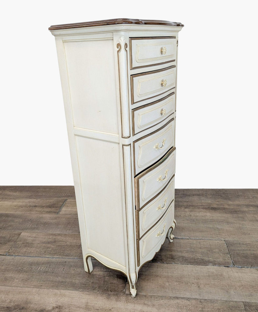 2. Angled view of a French-style Drexel Heritage dresser, showing ornate cabriole legs and curvaceous drawer fronts.