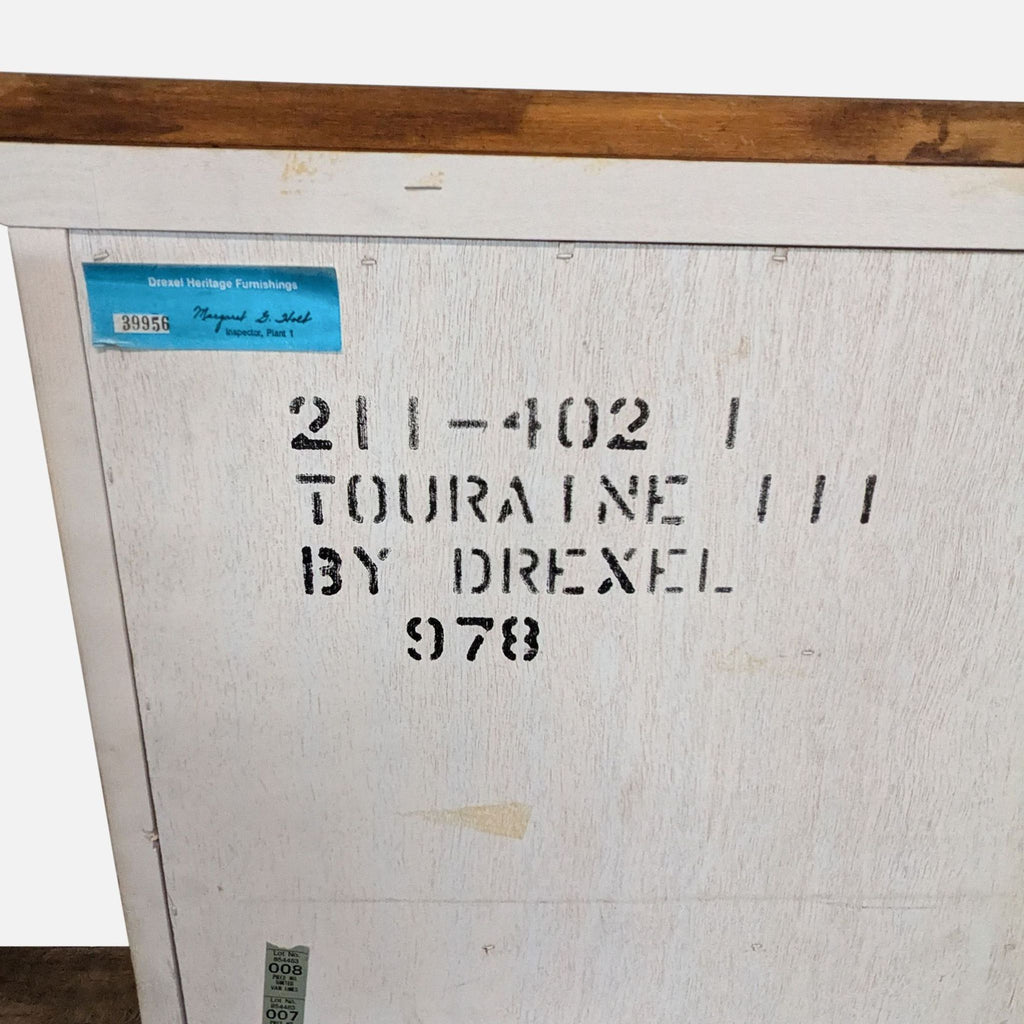 3. Back panel of Drexel Heritage dresser with “Touraine by Drexel” markings and inspection label visible.