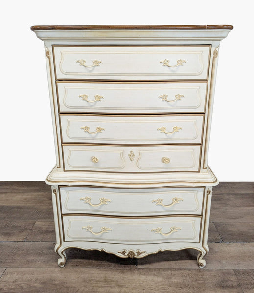 1. Front view of a Drexel Heritage French Provincial dresser, showcasing its curved design and ornate gold accents.