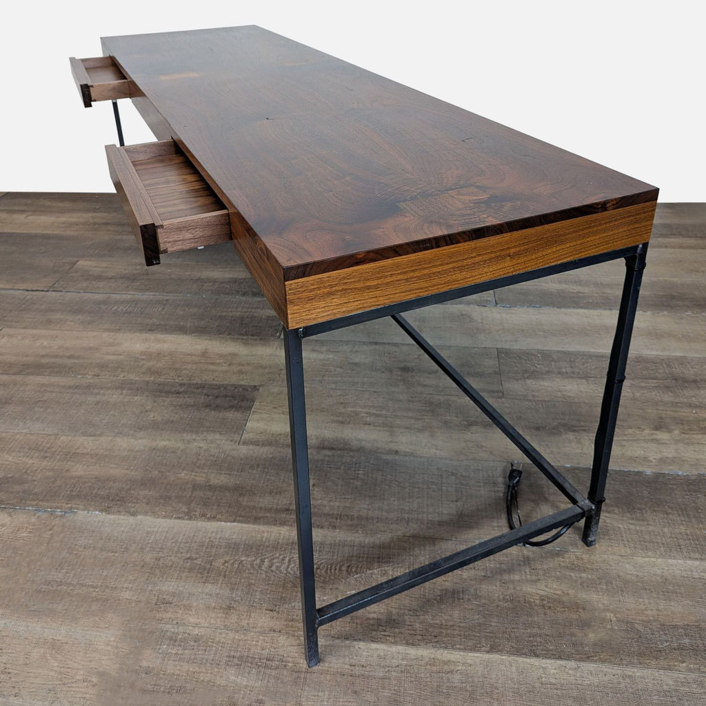 1. Reperch desk with a metal frame, wood top, two drawers, and built-in cord management, shown from an angle.  