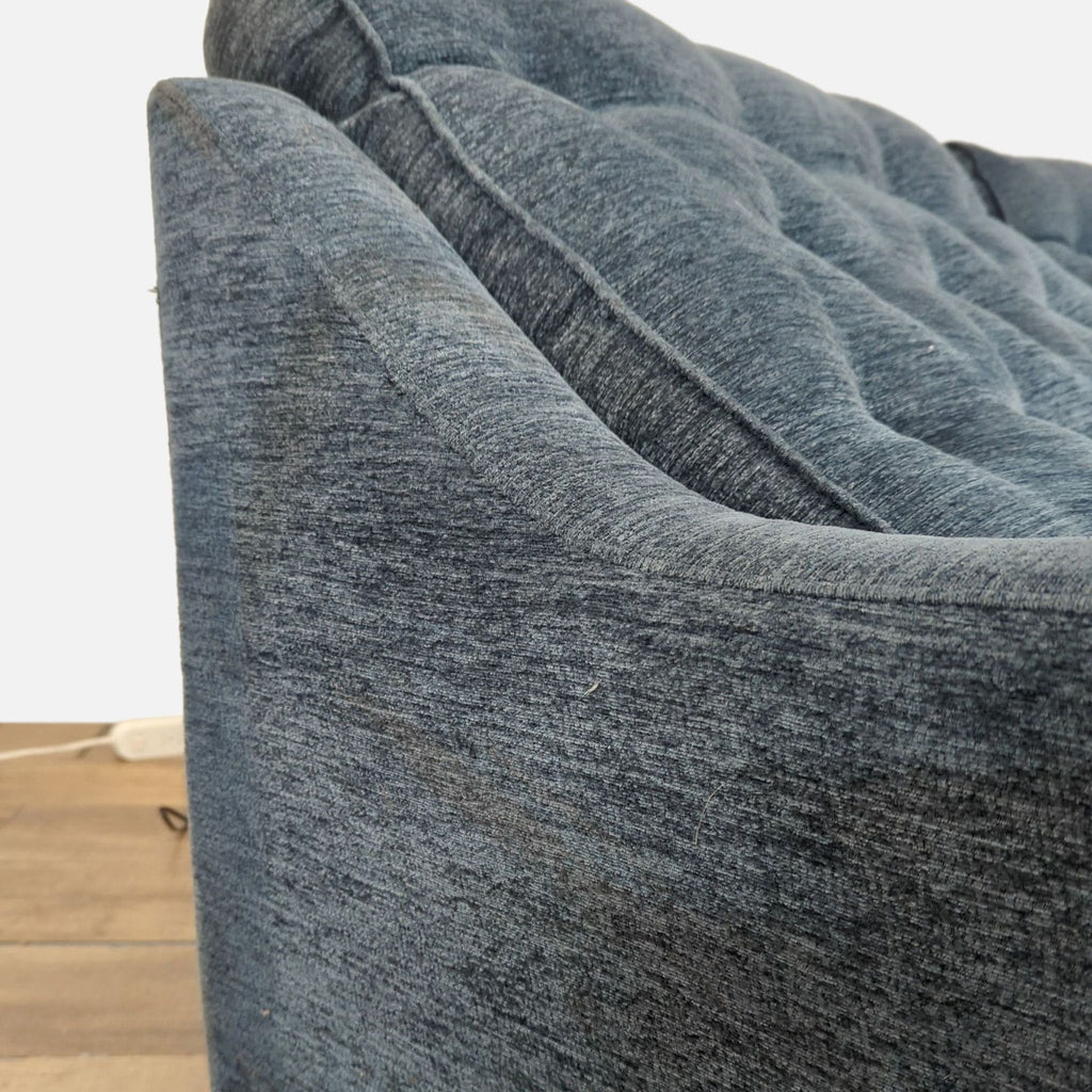 Close-up of Parker House Loveseat arm and button-tufted back, featuring plush blue fabric.