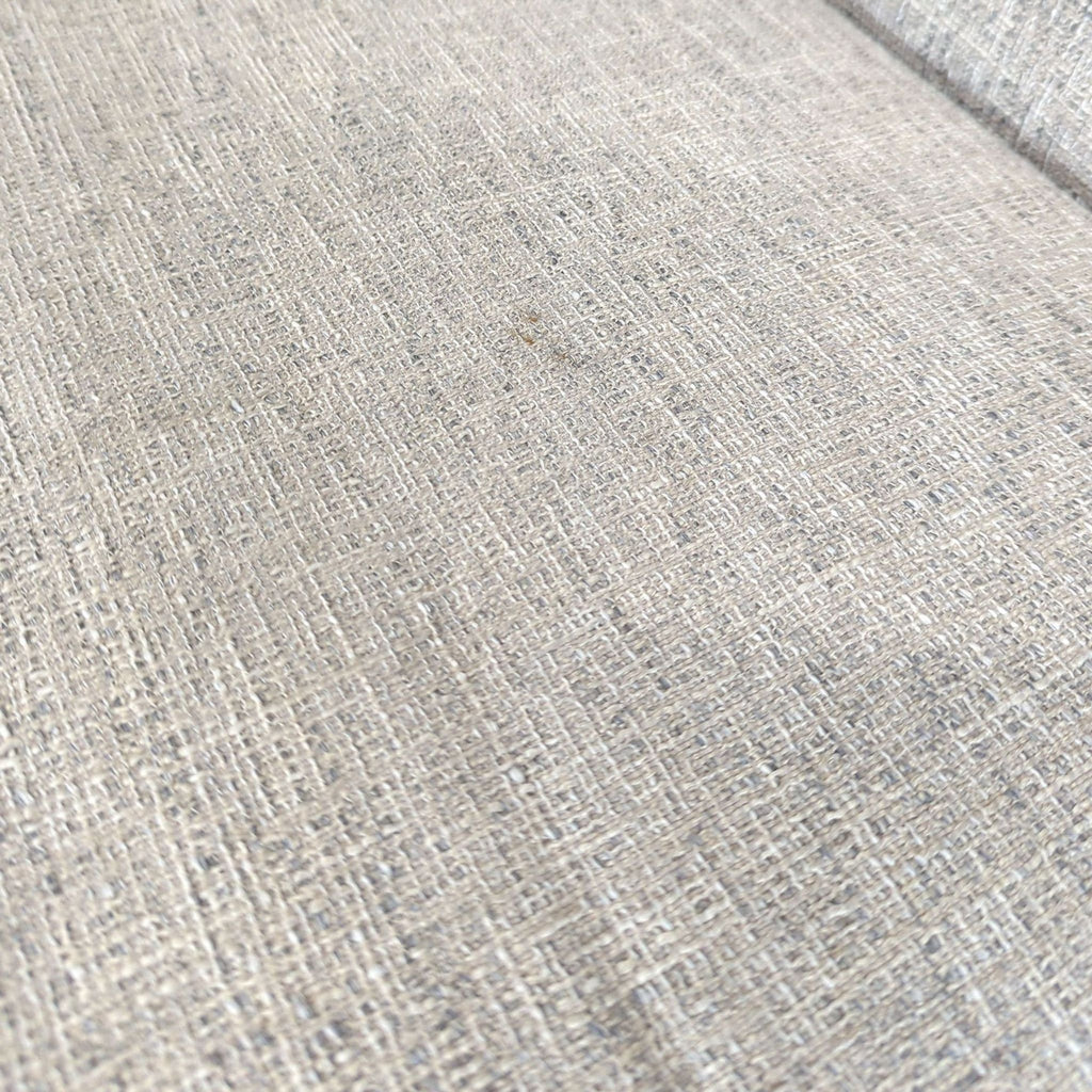 3. Close-up of the textured light gray fabric upholstery on a Reperch sectional sofa.