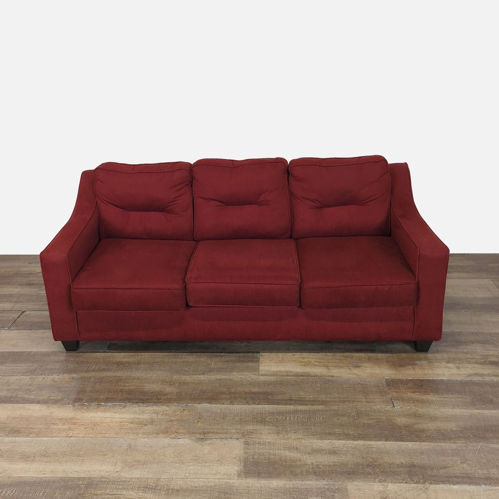 Front view of a red Reperch 3-seat sofa with tufted back cushions, track arms, and wood feet.