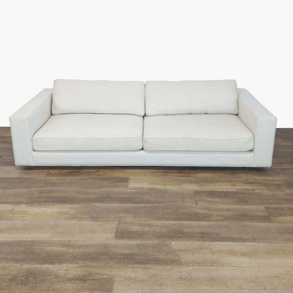 1. Reperch 3-seat sofa with neatly piped seat and back cushions and clean track arms shown on wood flooring.