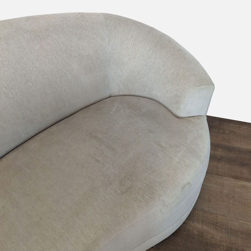 Detail of Crate & Barrel sofa’s curved lines and upholstery, highlighting the seamless modern design.