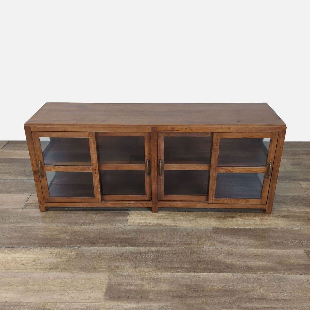 1. Pottery Barn entertainment center made from reclaimed teak and acacia wood, featuring sliding glass doors.