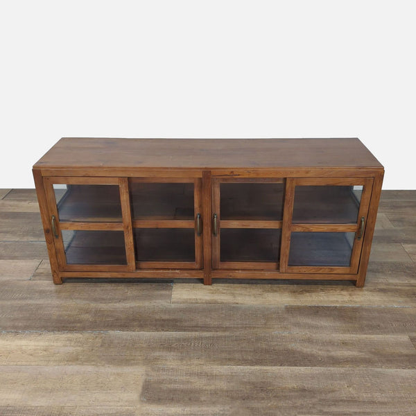 1. Pottery Barn entertainment center made from reclaimed teak and acacia wood, featuring sliding glass doors.