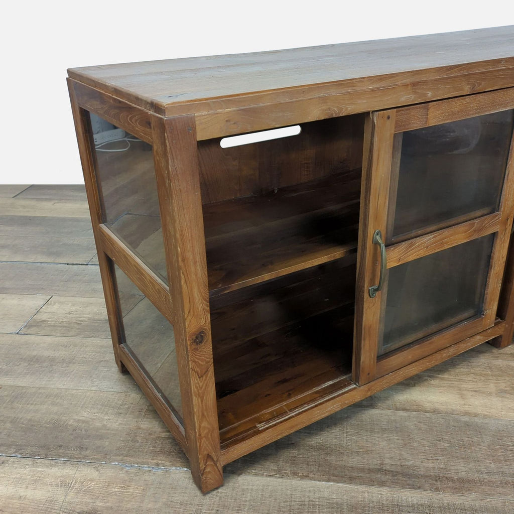 2. Side view of wood media console shows tempered glass panel, shelf, and a cord cutout at top rear.