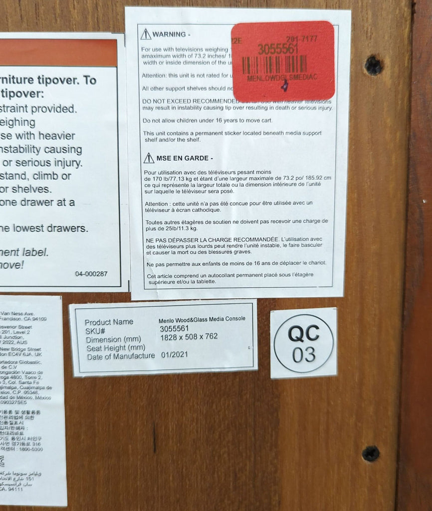 3. Product information label for Pottery Barn Menlo Wood & Glass Media Console with dimensions and warnings.