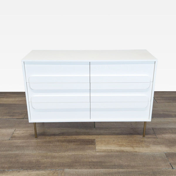1. Modern white Williams Sonoma dresser with 6 drawers and metal legs, shown on a wooden floor.
