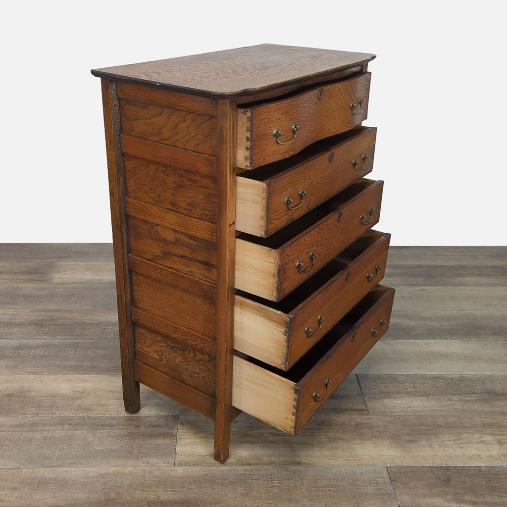 2. Angled view of Reperch oak dresser showing five drawers partially open with dovetail joints.  