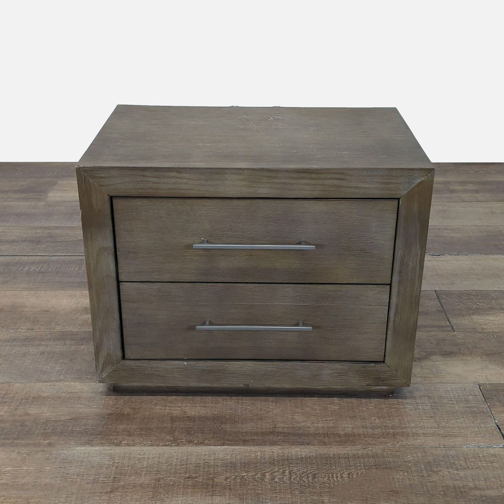 1. Reperch End Table with two front drawers and metal handles, shown on a wooden floor.