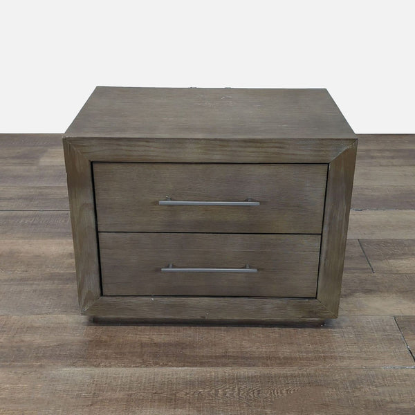 1. Reperch End Table with two front drawers and metal handles, shown on a wooden floor.