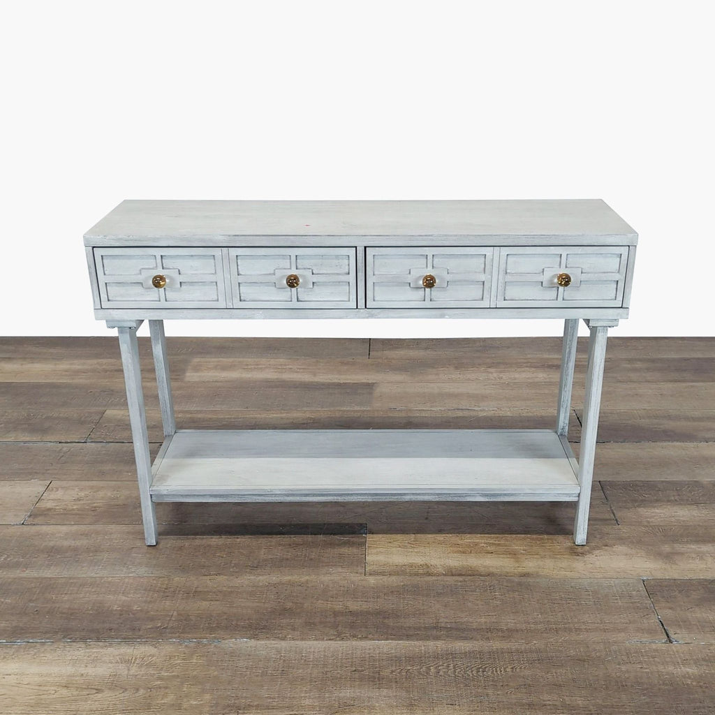 1. Light gray Reperch side and console table with four drawers and lower shelf, standing on wooden flooring.