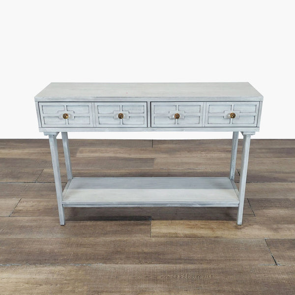 1. Light gray Reperch side and console table with four drawers and lower shelf, standing on wooden flooring.